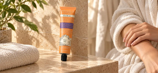 ROOPY hand cream in a post-shower body care setting with hands and a cotton robe