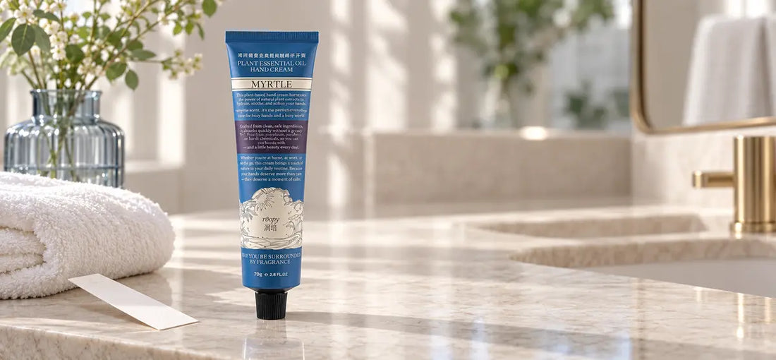 ROOPY scented hand cream on a calm bathroom vanity with a fragrance blotter